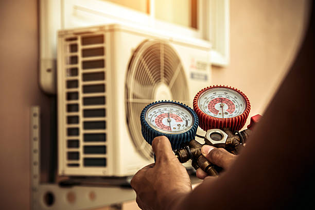 Professional Air Conditioning Service technician working in Pattonsburg, MO